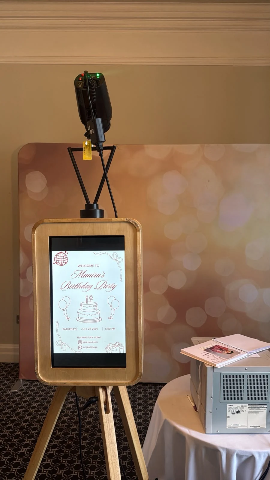 Vintage MoonBooth wooden setup at a real celebration